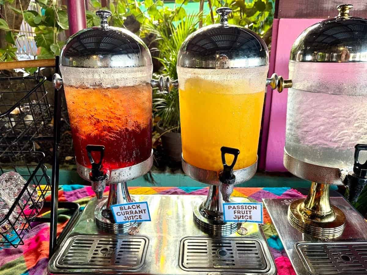 Breakfast buffet juices in a row.